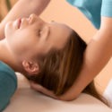 chiropractor adjusting a woman’s neck