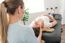 female patient getting a neck adjustment
