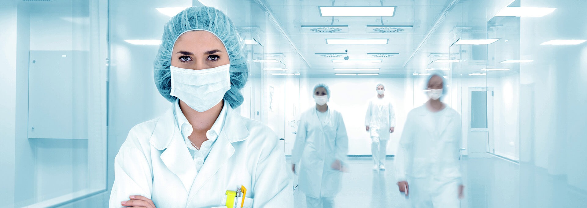 The hospital corridor is followed by doctors.